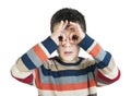 Child looking through his Ã¢â¬â¹Ã¢â¬â¹hands Royalty Free Stock Photo